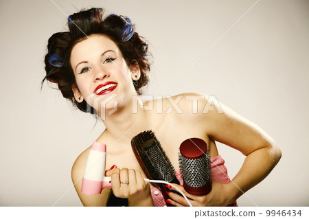 girl in curlers with accessories for styling hair girl in curlers with accessories for styling hair 9946434