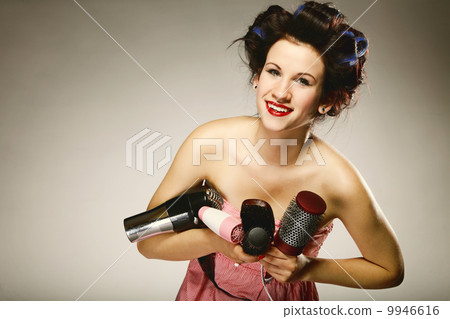 girl in curlers with accessories for styling hair girl in curlers with accessories for styling hair 9946616