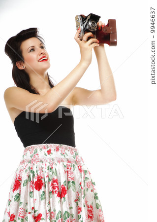 Pretty retro girl with vintage camera 9946637