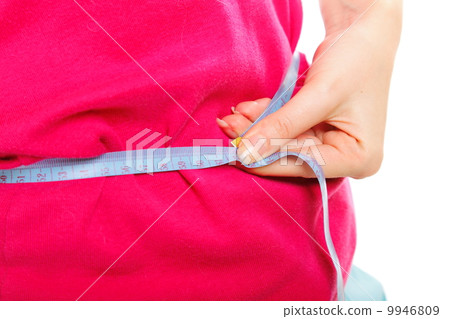 young sporty fit woman measuring waist 9946809