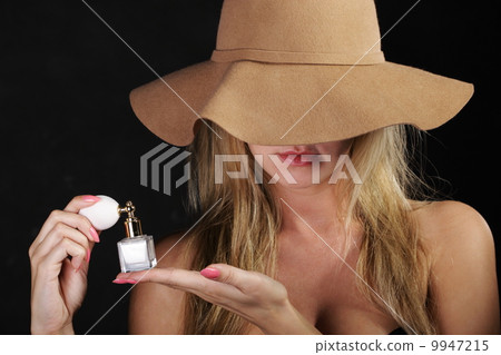 stylish woman with perfume bottle on black 9947215