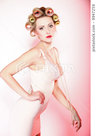 sexy woman in underwear curlers with beads 9947259