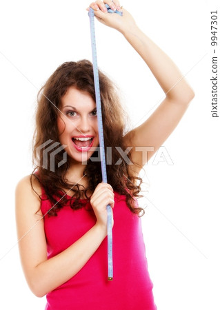 young sporty fit woman with measure tape 9947301