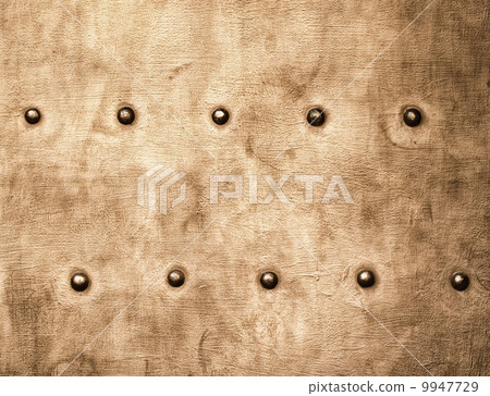 Grunge gold brown metal plate rivets screws background texture Grunge gold brown metal plate rivets screws background texture 9947729