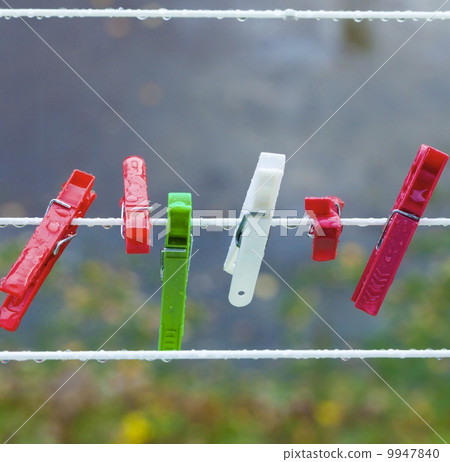 Colorful washing laundry clips on strip outdoor. Background. Colorful washing laundry clips on strip outdoor. Background. 9947840