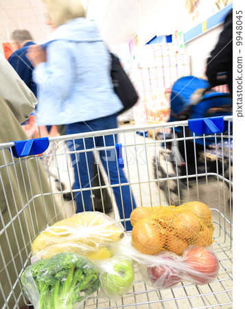 shopping cart with grocery at supermarket 9948045
