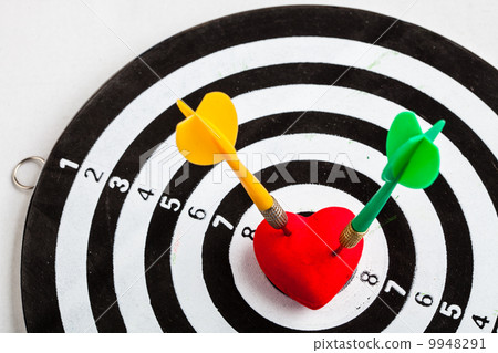 Black white target with two darts in heart love symbol as bullseye 9948291