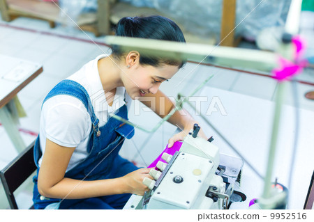 Indonesian seamstress in a textile factory 9952516