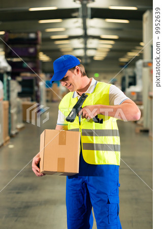 worker scans package in warehouse of forwarding worker scans package in warehouse of forwarding 9952639