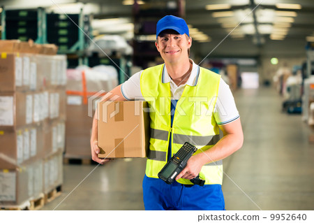 worker scans package in warehouse of forwarding 9952640