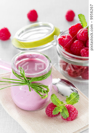 Raspberry yogurt with ripe raspberries Raspberry yogurt with ripe raspberries 9956267