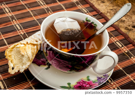 cup of tea with pastry after dinner 9957350