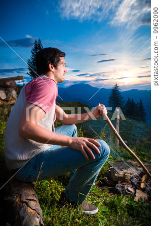 Alps - Man at campfire in Bavarian mountains 9962090