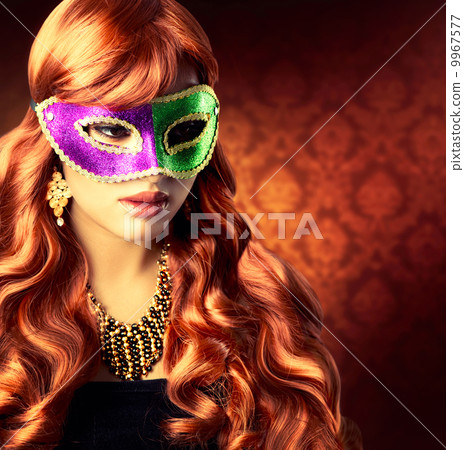 Beautiful Girl in a Carnival mask 9967577