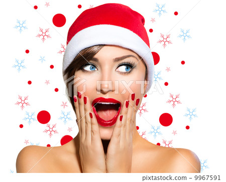 Christmas Woman. Beauty Model Girl in Santa Hat 9967591