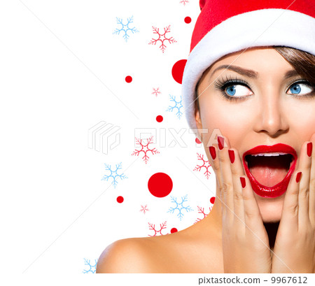 Christmas Woman. Beauty Model Girl in Santa Hat 9967612