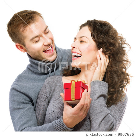 Valentine Gift. Happy Young Couple with Valentine's Day Present 9967656