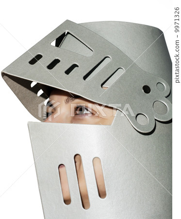 Woman with knight's helmet on the head 9971326