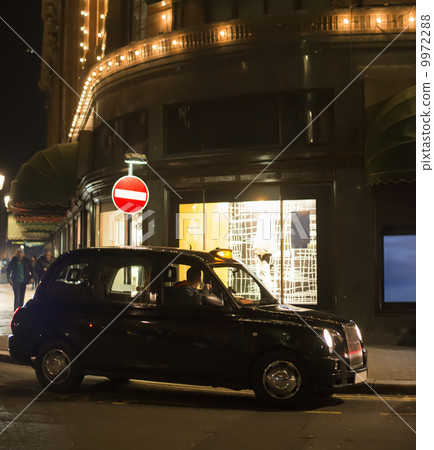 Taxi in London in front of a shopping center 9972288
