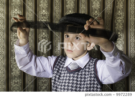 Child considered analog photographic film Child considered analog photographic film 9972289