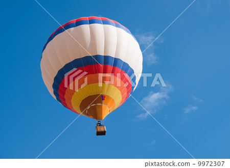 Multicolored Balloon in the blue sky Multicolored Balloon in the blue sky 9972307