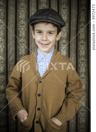 Smiling child in vintage clothes and hat 9972473