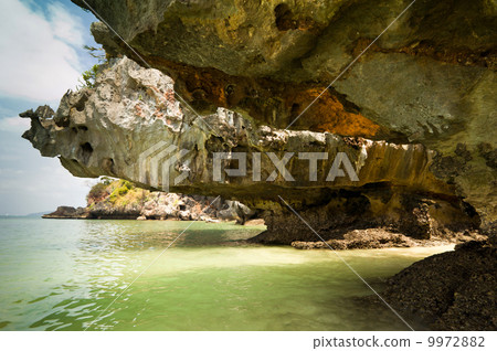 Tropical beach view from karst limestone cave. Krabi, Thailand 9972882