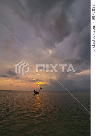 Sunset at tropical beach with fishing boat. Thailand 9972888