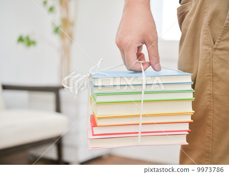 Carrying a book Carrying a book 9973786