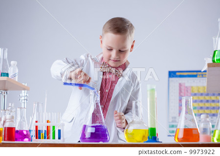 Inquisitive naturalist mixes reagents in flask 9973922