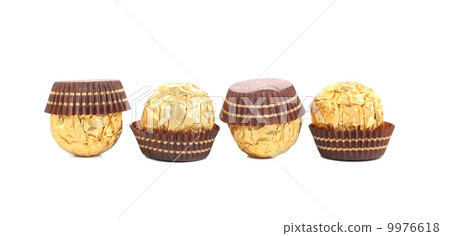 Four in row chocolate bonbons. 9976618