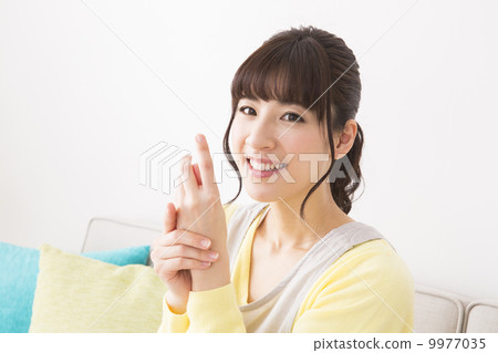 A woman in an apron A woman in an apron 9977035