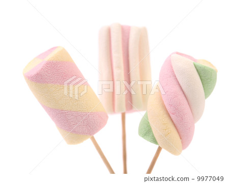 Three different colorful marshmallow on sticks. Three different colorful marshmallow on sticks. 9977049