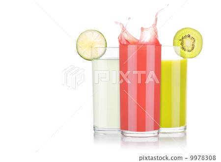 tasty summer fruit drinks in glass with splash 9978308