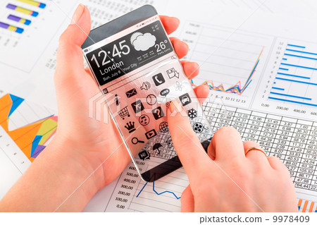 Smartphone with transparent screen in human hands. 9978409