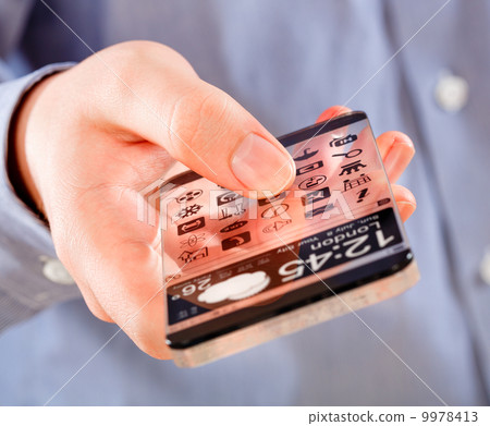 Smartphone with transparent screen in human hands. 9978413