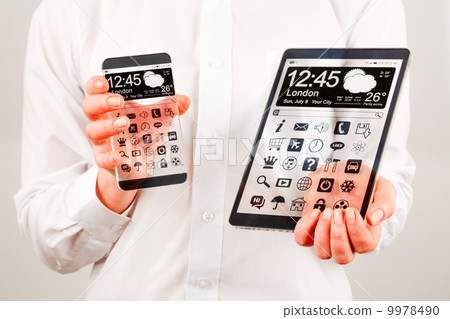 Smartphone and tablet with transparent screen in human hands. 9978490