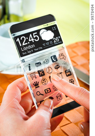Smartphone with transparent screen in human hands. Smartphone with transparent screen in human hands. 9978494