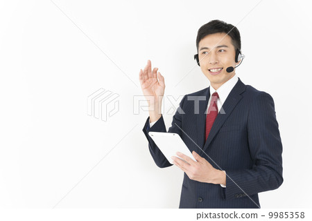 Young male operator with tablet 9985358