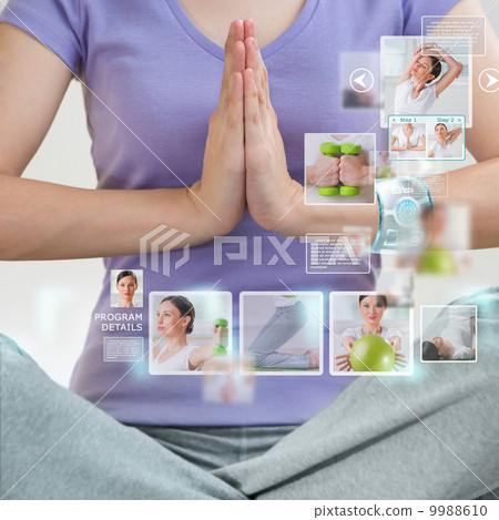 Woman doing exercise wearing smart wearable device with futurist 9988610