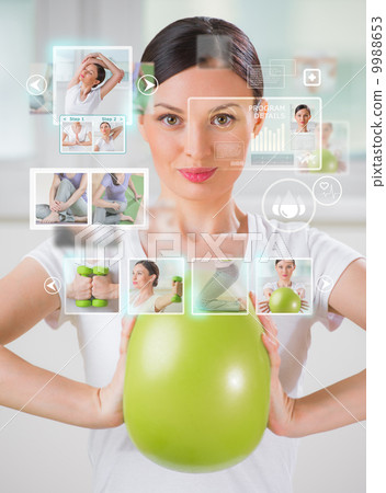 Sporty woman working out using modern virtual interface 9988653