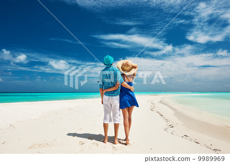 Couple in blue on a beach at Maldives Couple in blue on a beach at Maldives 9989969