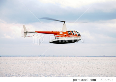 commercial helicopter flying in the sky 9990892