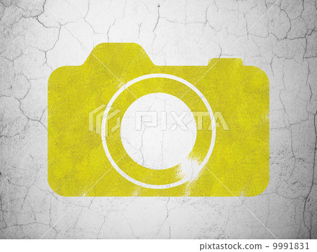 Travel concept: Photo Camera on wall background 9991831