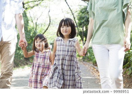 Families taking a walk Families taking a walk 9998951