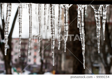 icicles which are hanging down from a roof icicles which are hanging down from a roof 9999154