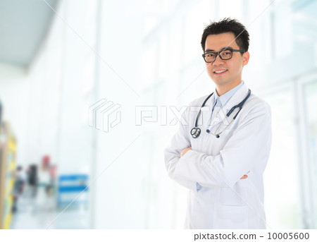 Asian doctor standing at hospital corridor 10005600