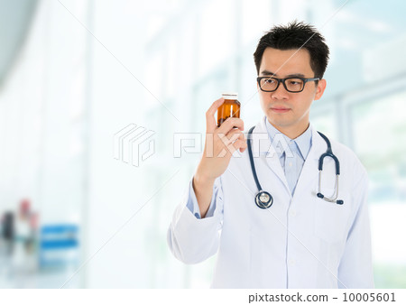 Asian doctor checking drugs inside hospital Asian doctor checking drugs inside hospital 10005601