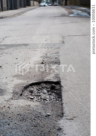 Very big pothole on the road 10008631