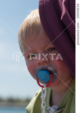 Portrait of baby with pacifier 10008638